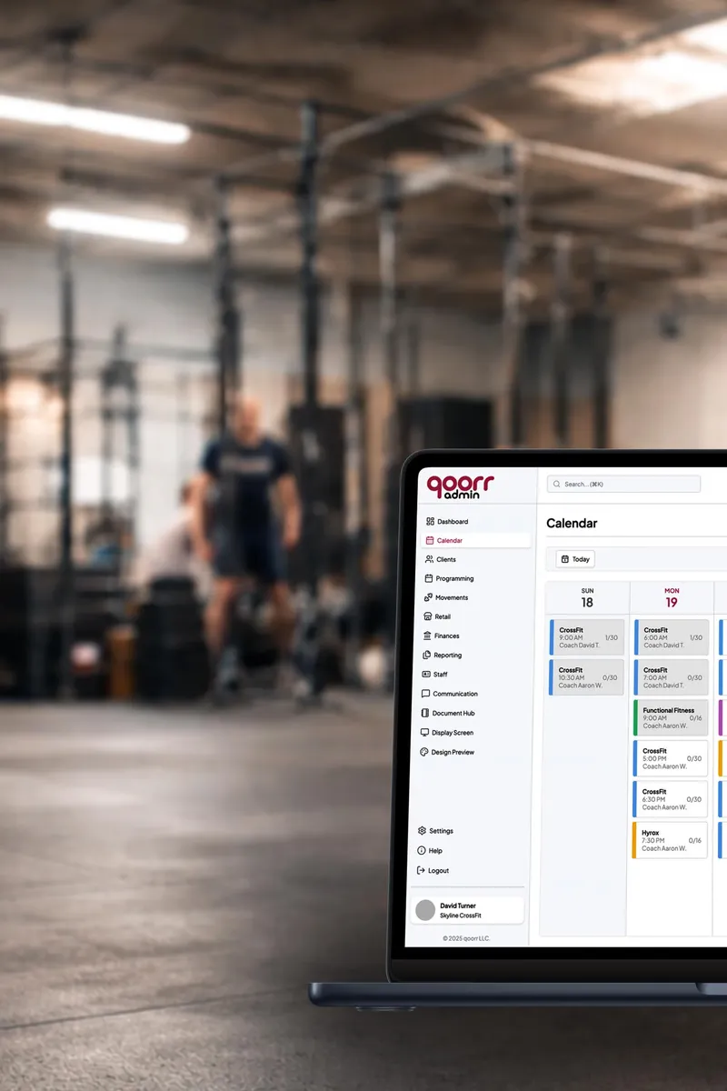 The qoorr class calendar open on a laptop in a gym.